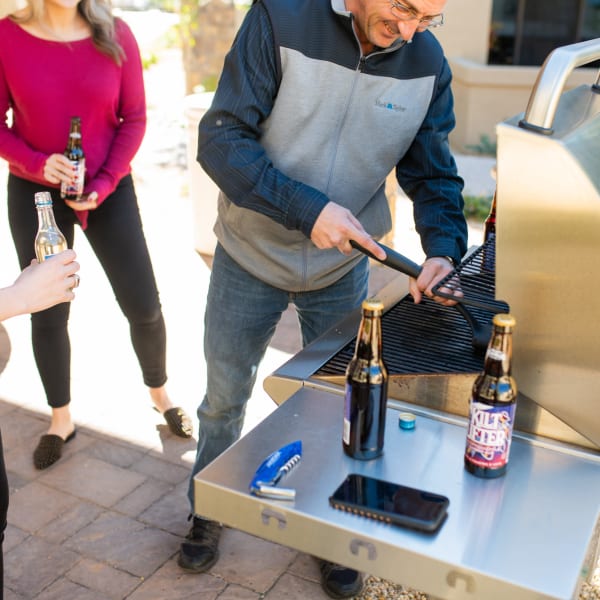 Residents getting ready to barbecue on the gas grills at San Capella in Tempe, Arizona