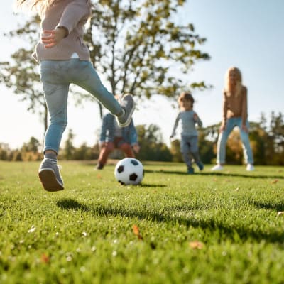 Kids playing with a ball in a park near The Bricks in Joint Base Lewis McChord, Washington