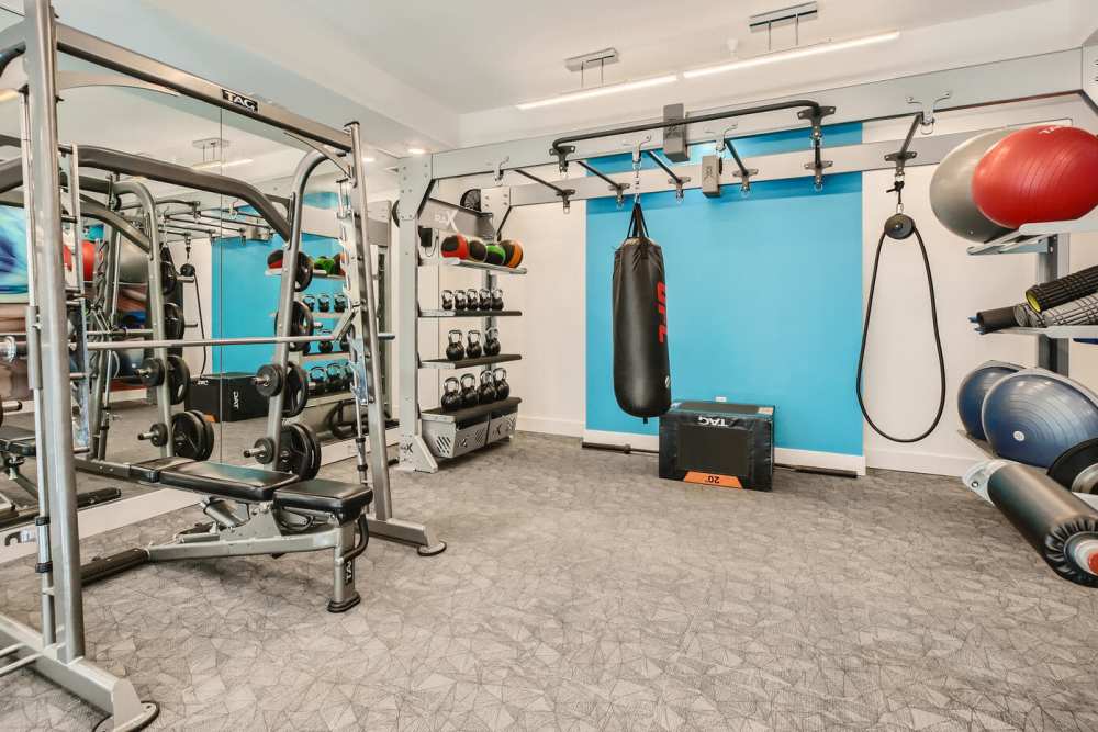 Fitness room with weight bench at Soba Apartments in Jacksonville, Florida