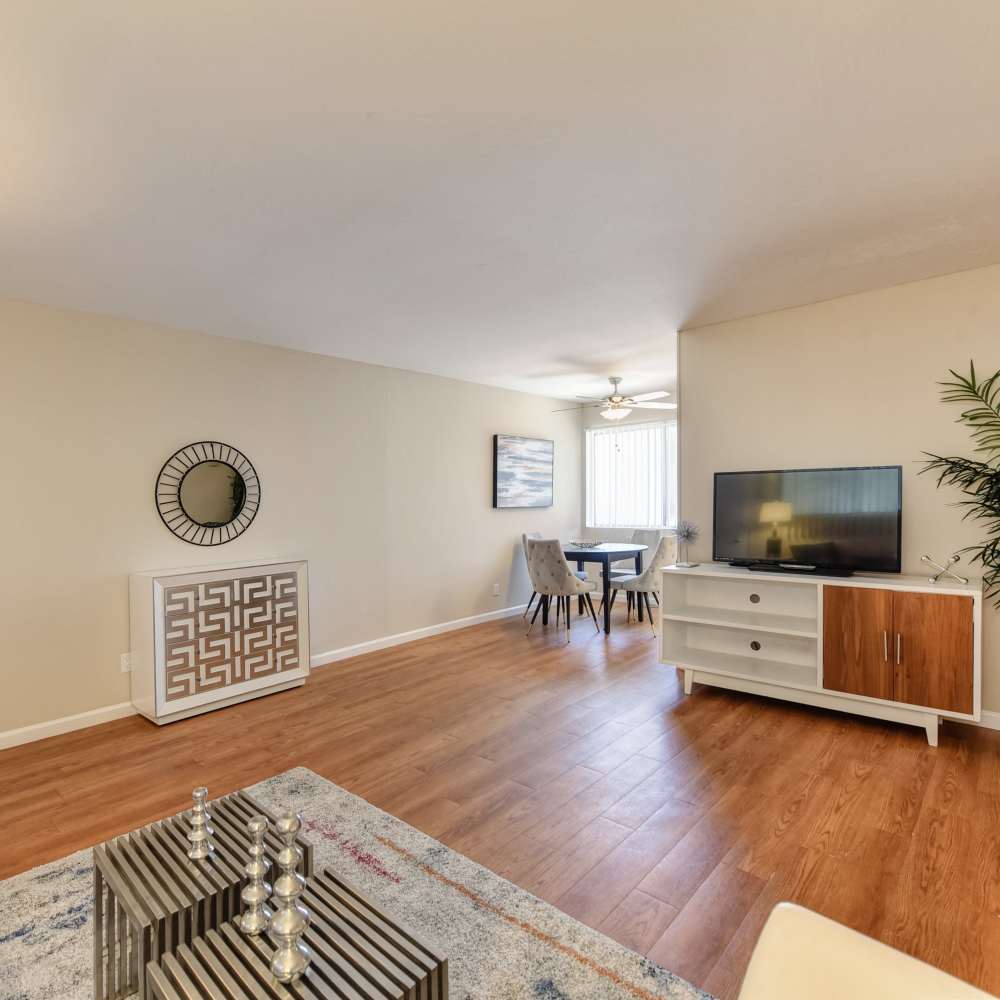 Living room with center table and television at Glenwood Garden Apartments in Mountain View, California