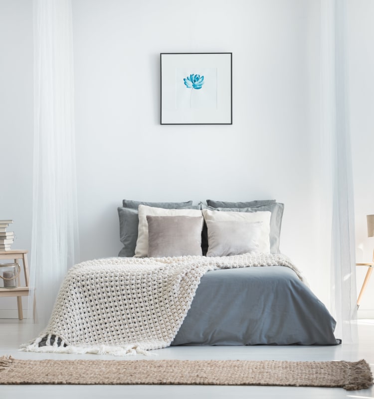 Simply decorated bedroom in model home at Haven New Providence in New Providence, New Jersey