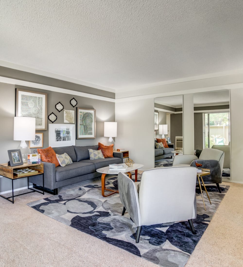 Well-decorated living area with an accent wall in a model home at Sofi Fremont in Fremont, California