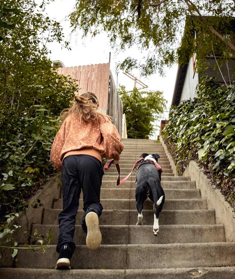Resident walking her dog near Rutledge Flats in Nashville, Tennessee