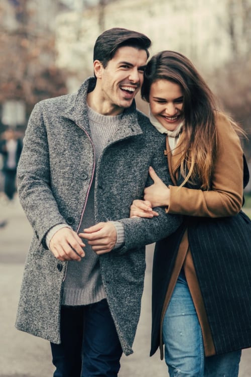 Cute couple walking aroud town near 501 H Street in Washington, District of Columbia