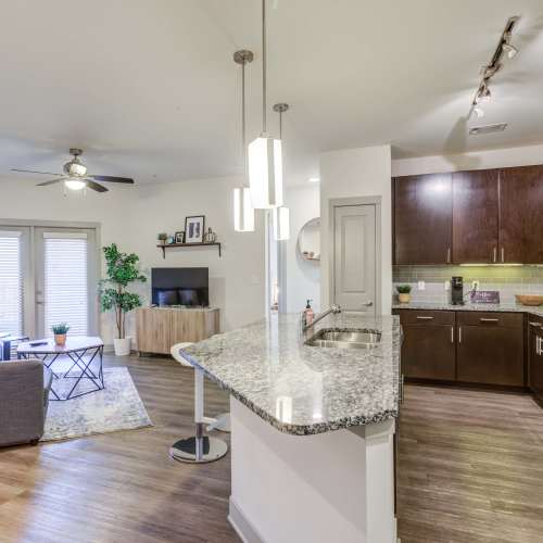 Beautiful kitchen and living room in one picture at The Carillon in Nashville, Tennessee