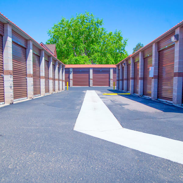 Outdoor storage units with bright doors at StorQuest Self Storage in Aurora, Colorado