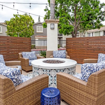 Beautifully decorated fire pit area with comfortable seating at Sofi Westview in San Diego, California