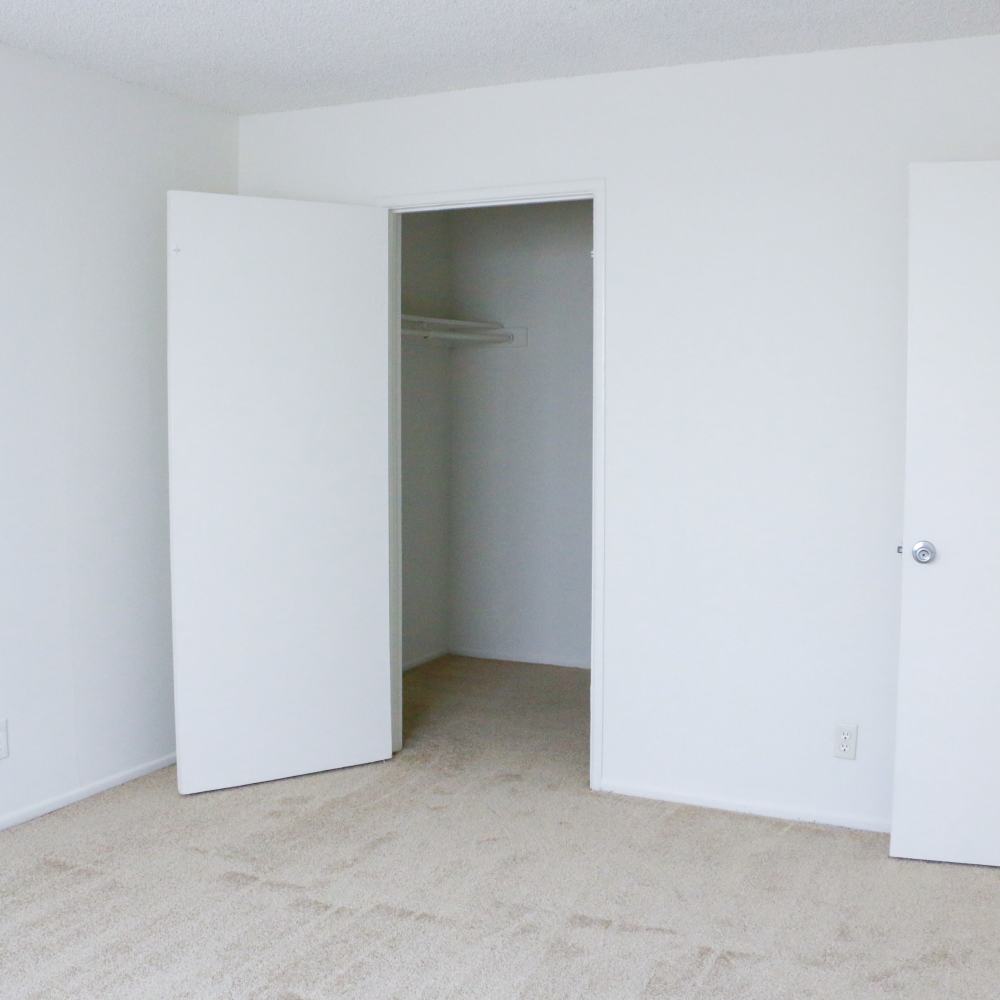 Bedroom with walk-in closets at Huntington Reef in Huntington Beach, California
