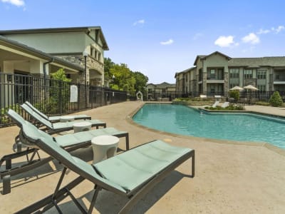 Lounge chairs on the pool deck at Auberge of Tyler in Tyler, Texas