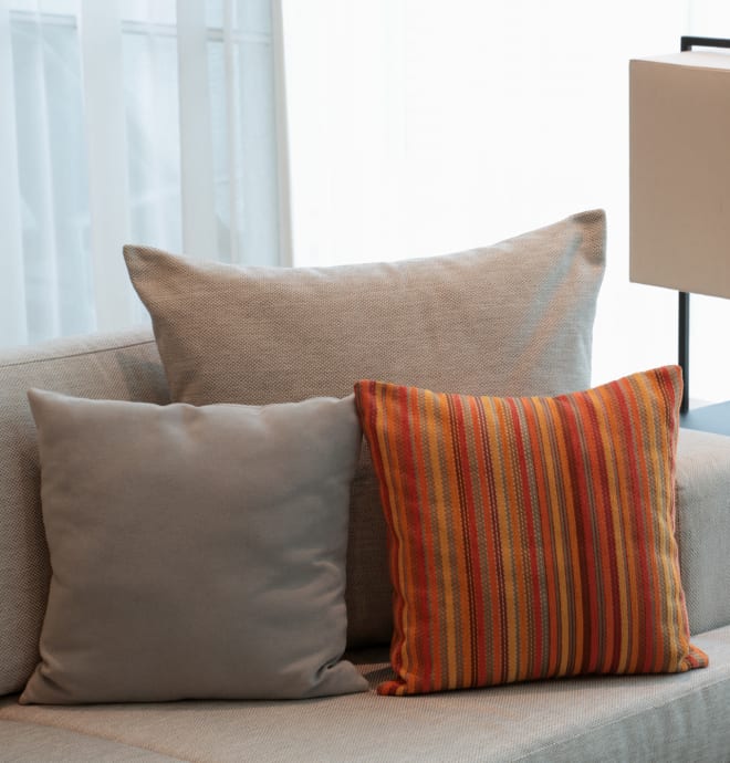 Comfy couch with pillows at The Annex