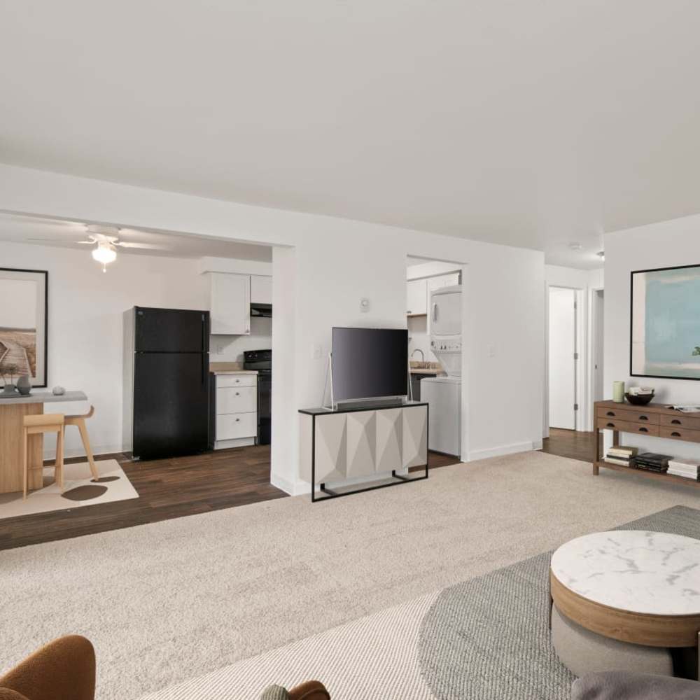 Living room and dining area of an open floor plan model home at Bluffs at Evergreen in Everett, Washington