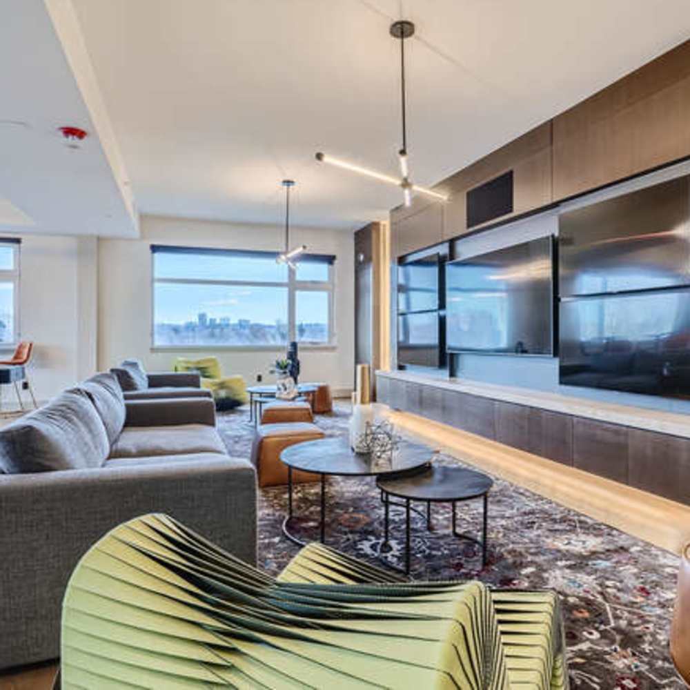 living room area with multiple TVs at The View at Wash Park in Denver, Colorado