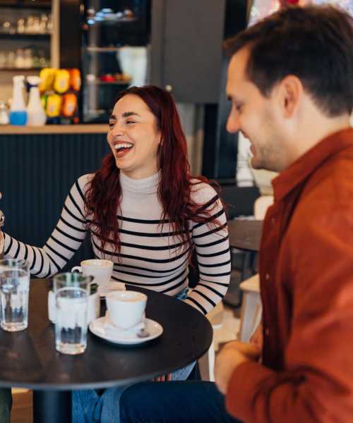 Residents enjoying coffee in the cafe near Mill Creek Apartments in Cross Plains, Wisconsin