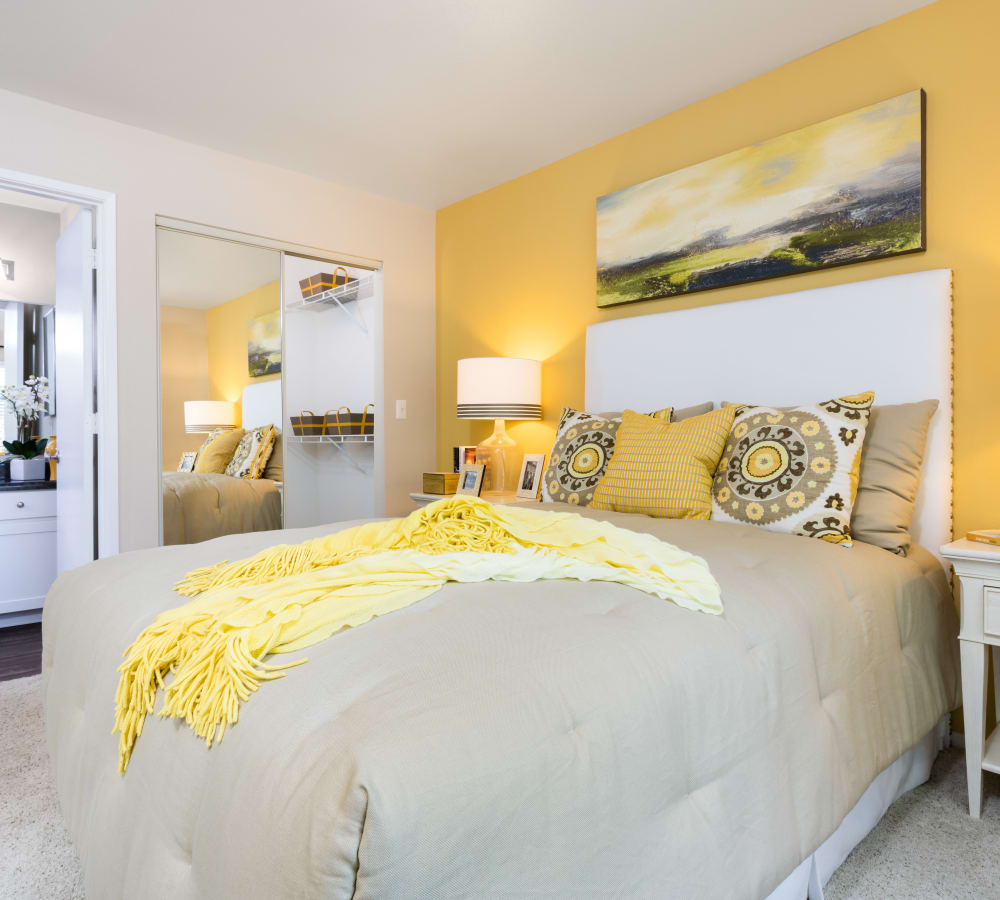 Plush carpeting and draped windows in a model home's bedroom at Skyline at Murrayhill in Beaverton, Oregon