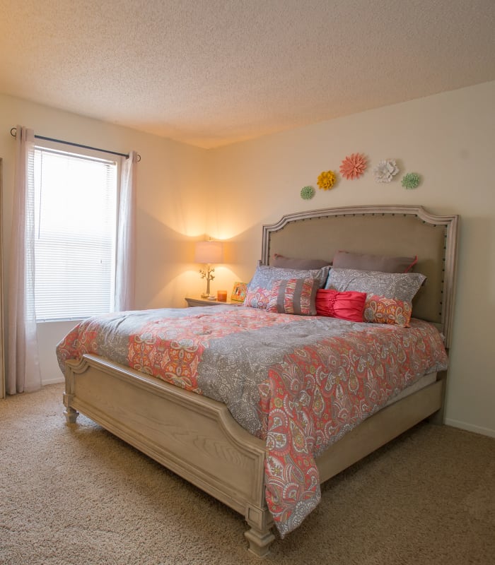Spacious carpeted bedroom at Cimarron Trails Apartments in Norman, Oklahoma