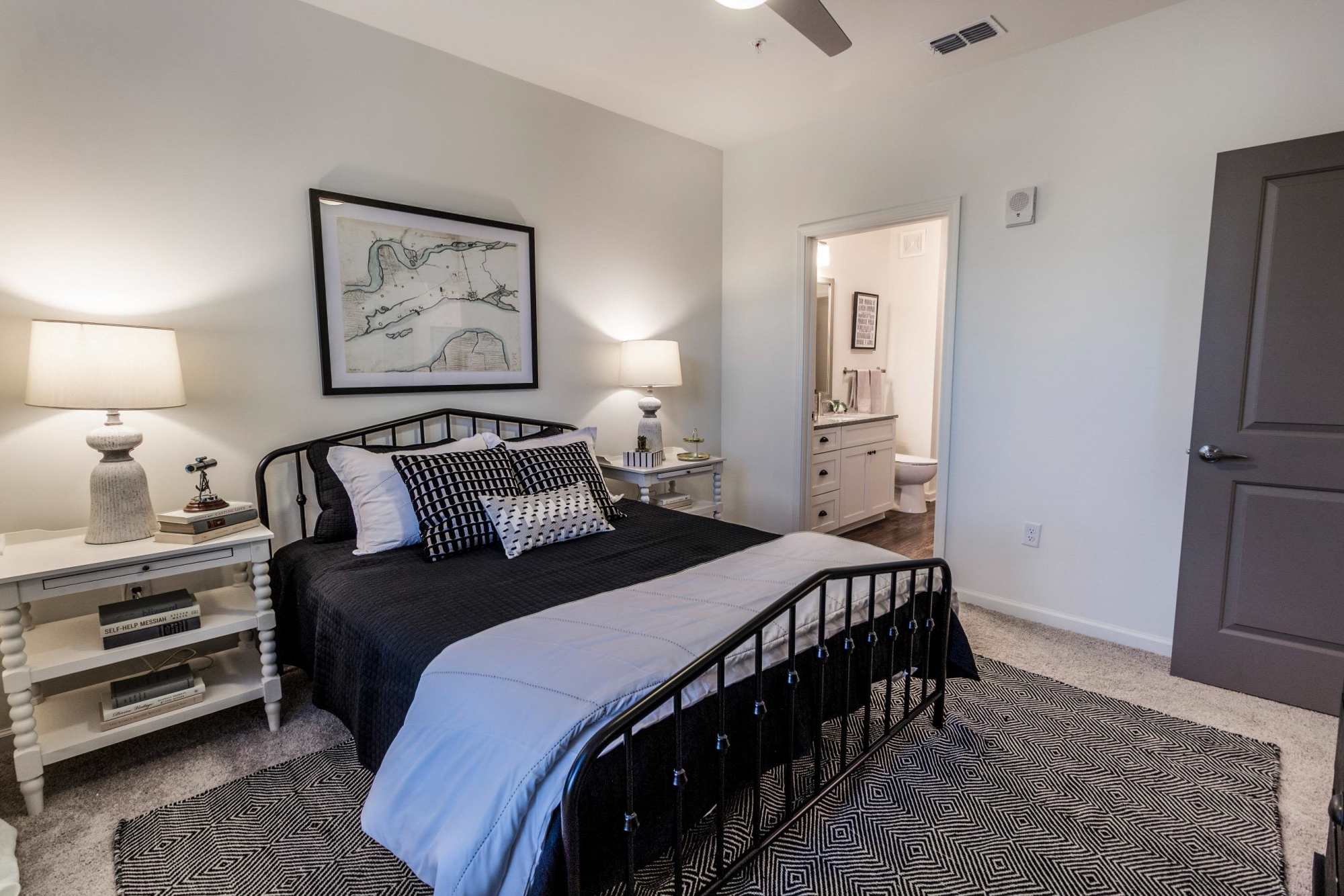 Bedroom with bed, side tables, and soft lighting at Brisa at St. Augustine in St. Augustine, Florida