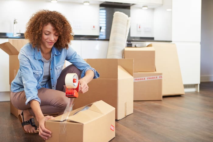 Woman packing up in preparation for her move to Advantage Highway20 Odessa in Odessa, Texas