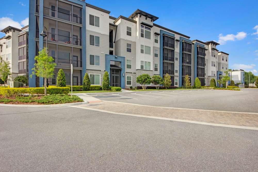 Community exterior with tress at The Courtney at Lake Shadow in Orlando, Florida
