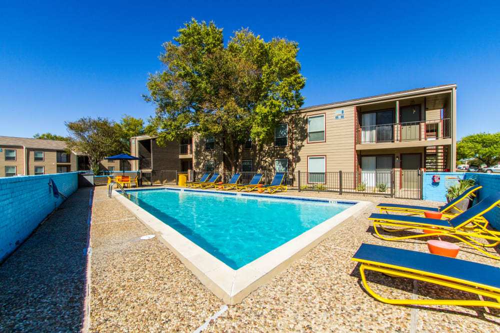Sparkling blue pool at Sundance Apartments in College Station, Texas