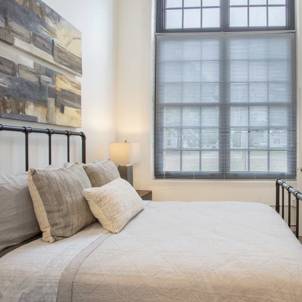 Cozy bedroom at Lofts at Inman Mills in Inman, South Carolina