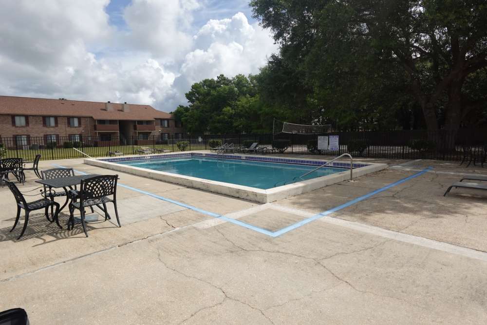 pool and outdoor furniture at Ember Ridge Apartments in Pensacola, Florida