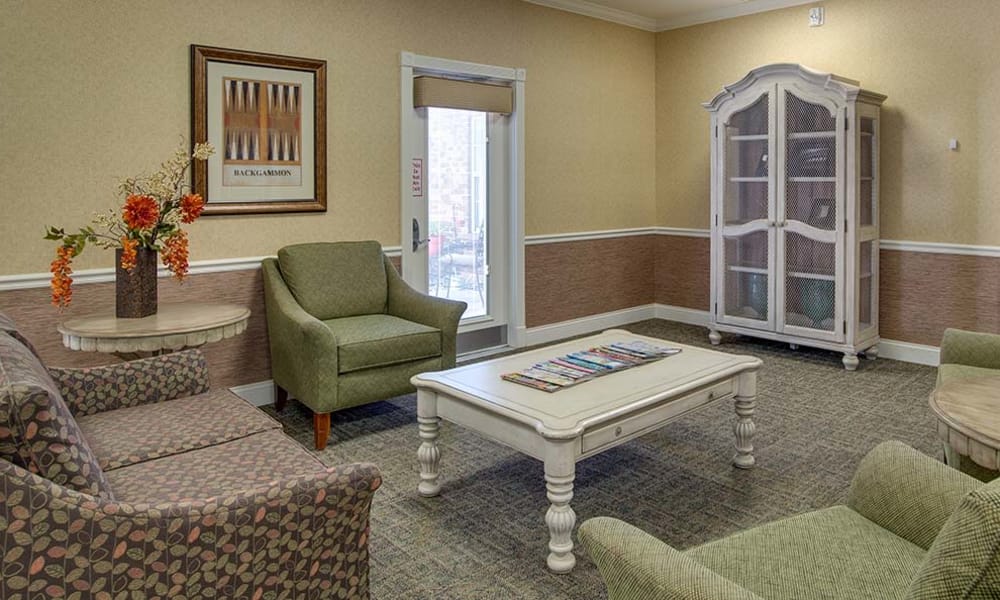 Cozy fireplace in assisted living common area for residents at Auburn Creek Senior Living in Cape Girardeau, Missouri