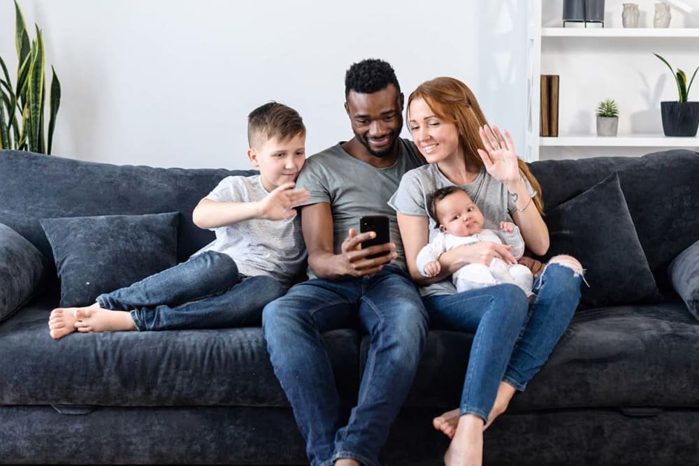 Family sitting on their couch at La Prensa Libre in Los Angeles, California