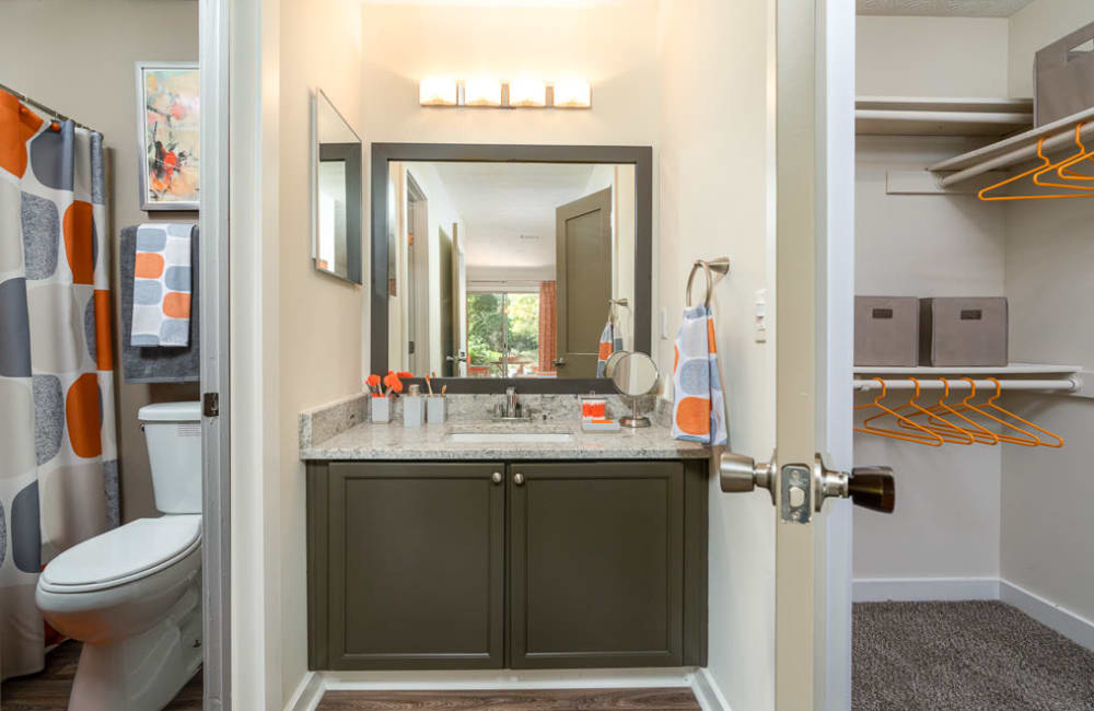 Bathroom and walk-in closet in an apartment at The Hundred Exchange in Fayetteville, Georgia