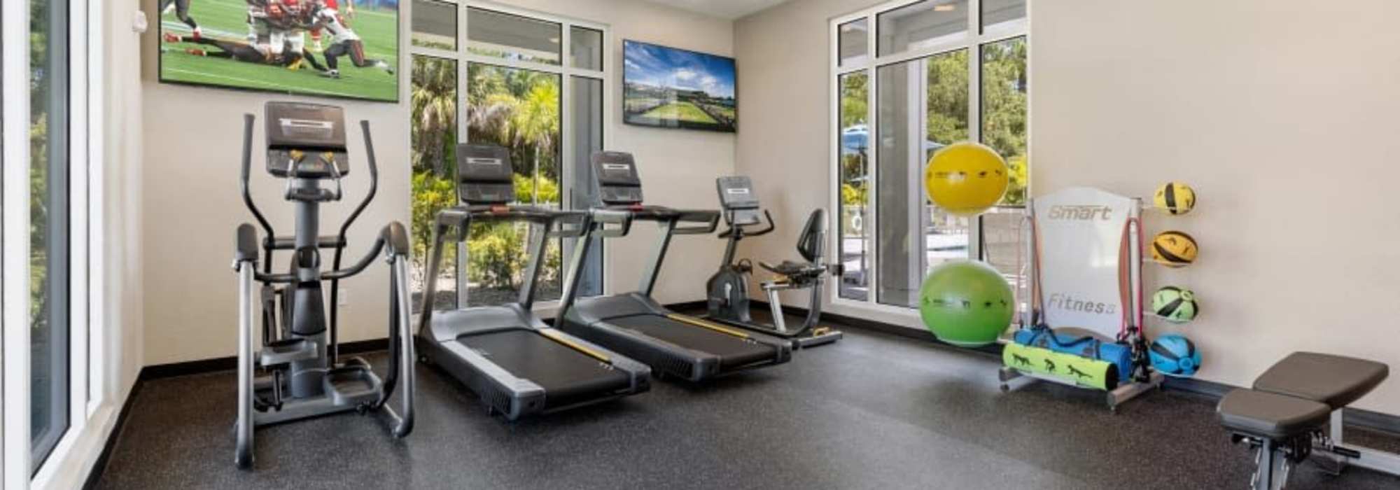 Fitness center with treadmill at The Residences at Creighton Waterway in North Port, Florida