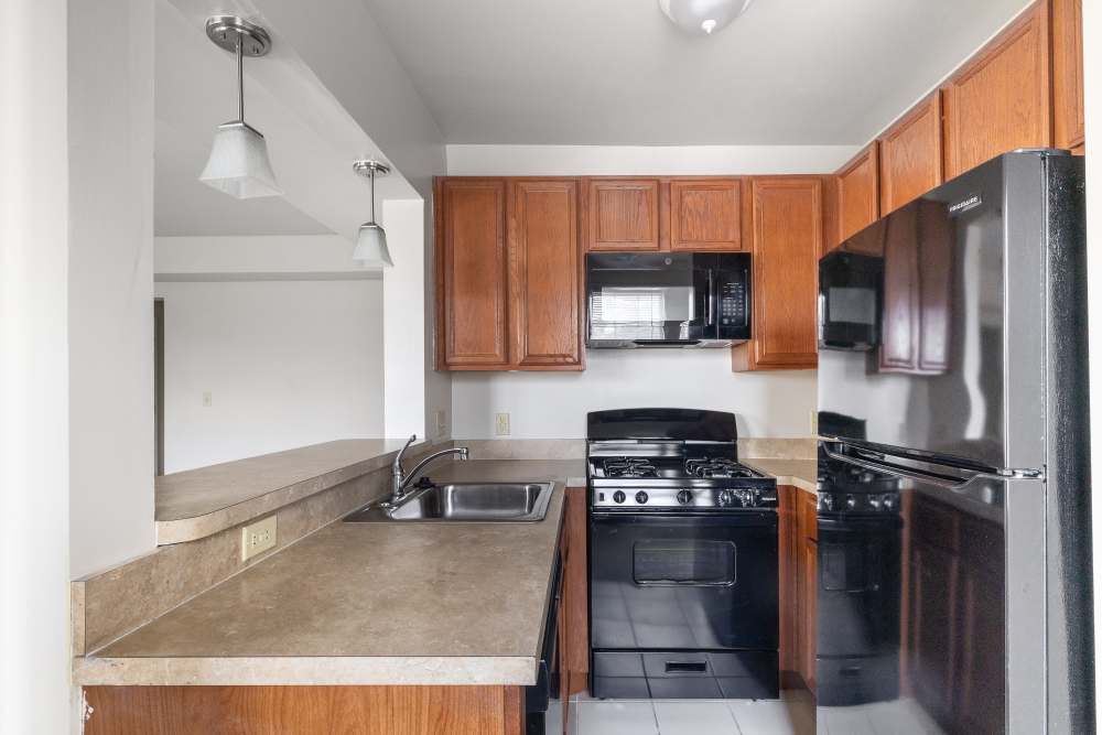 Kitchen with granite countertop at Dundalk Village in Dundalk, Maryland
