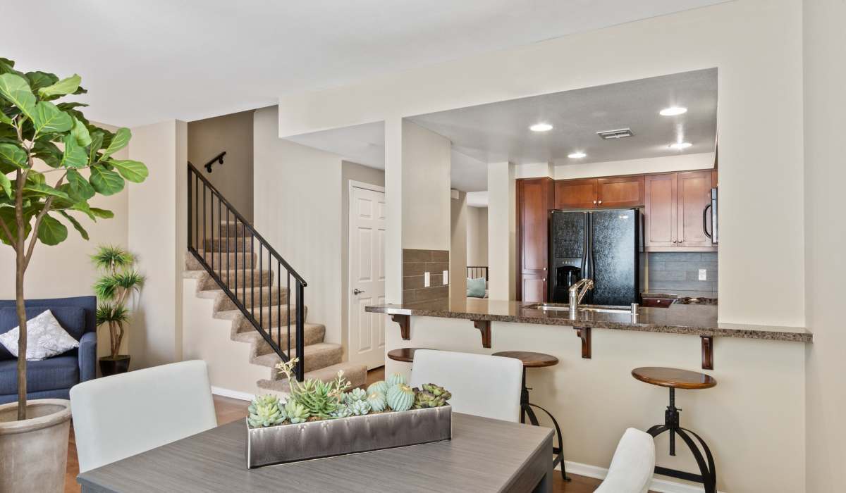Beautiful kitchen with counter seating at Ontario Town Square Townhomes in Ontario, California