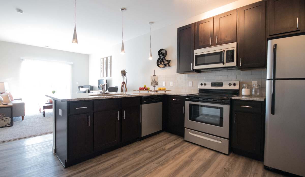 A modern kitchen with stainless-steel appliances at Mirada Apartments in Lewis Center, Ohio