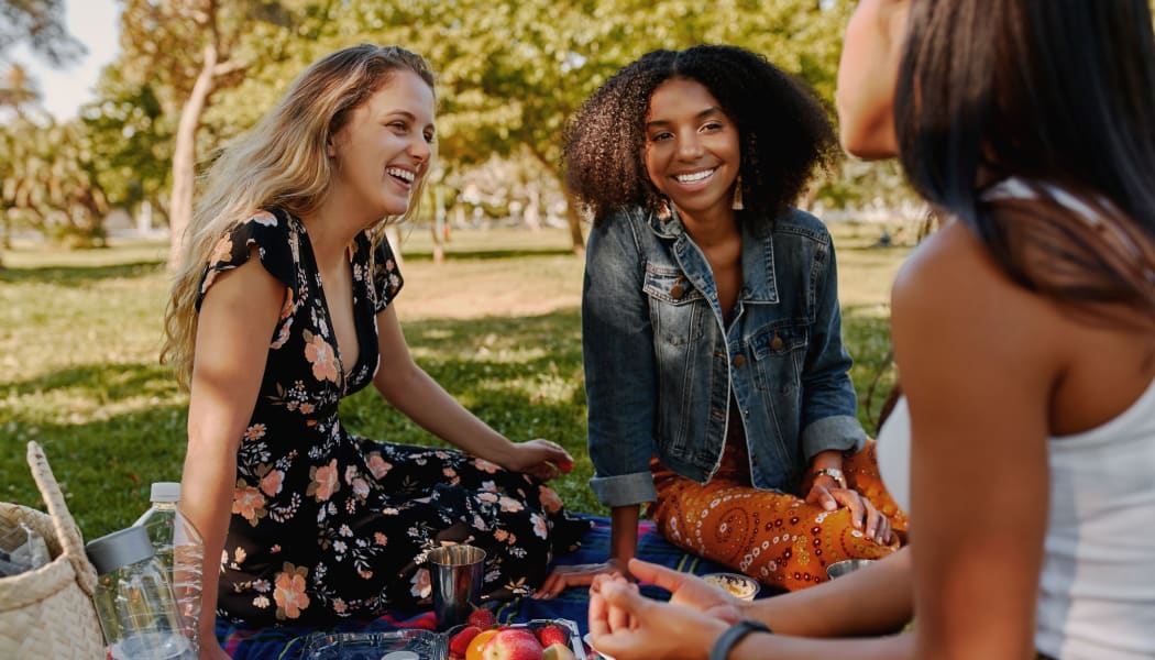 Friends enjoying lunch together in Wichita, Kansas near Crown Chase Apartments