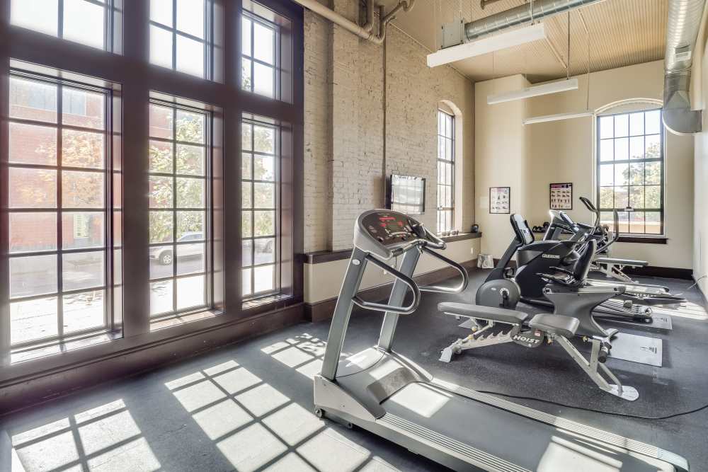 Fitness center with treadmills on rubber flooring at Rumely Lofts in Des Moines, Iowa
