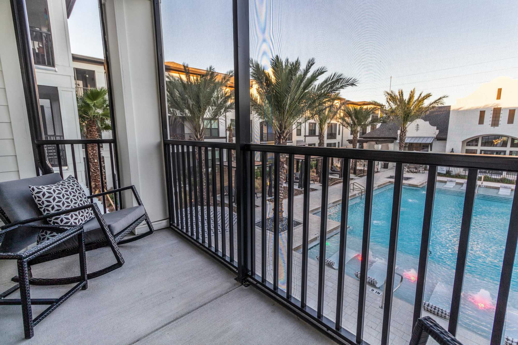 Private balcony with seating and pool view at Brisa at St. Augustine in St. Augustine, Florida