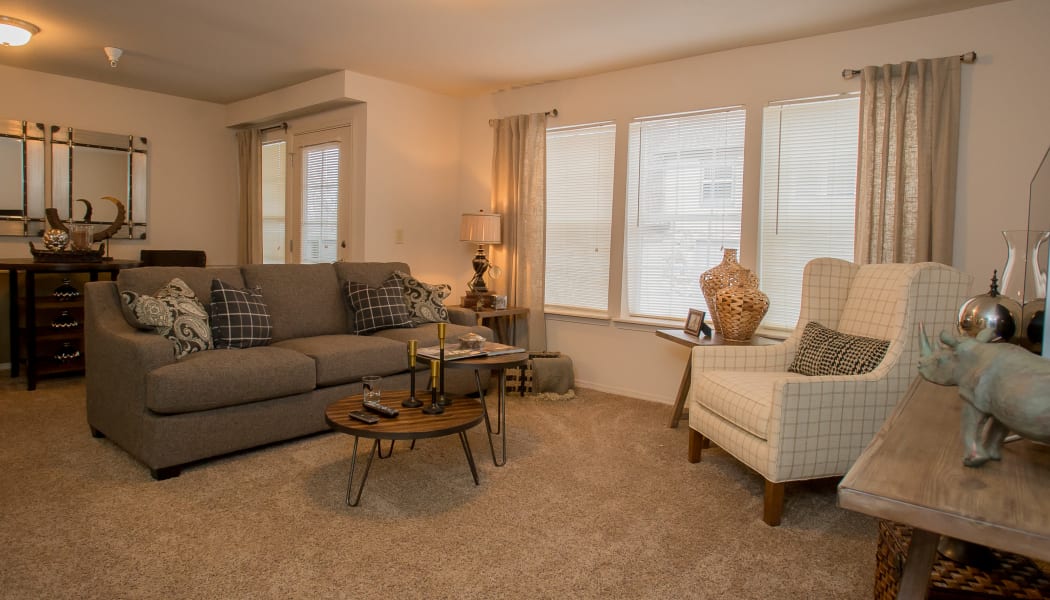 Large windows in the living room at Villas of Waterford Apartments in Wichita, Kansas