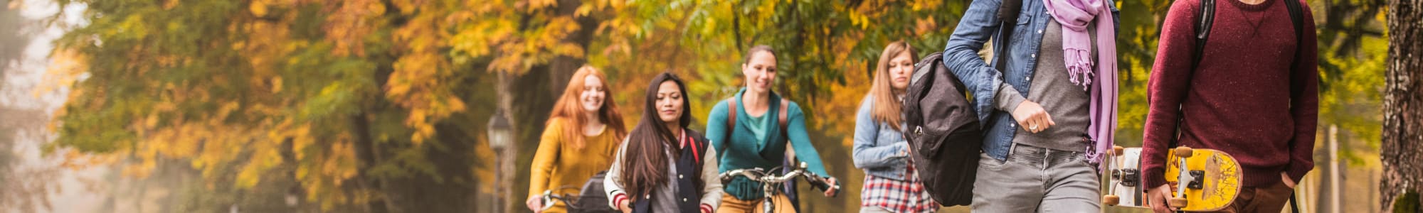 Group of students walking near Carriage Place Apartments