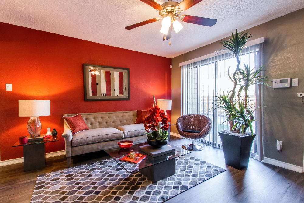 Spacious living room with ceiling fan at Sausalito Apartments in College Station, Texas