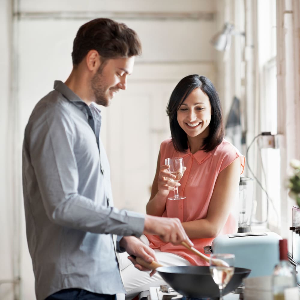 Residents cooking in their home at The Knoll Redmond in Redmond, Washington