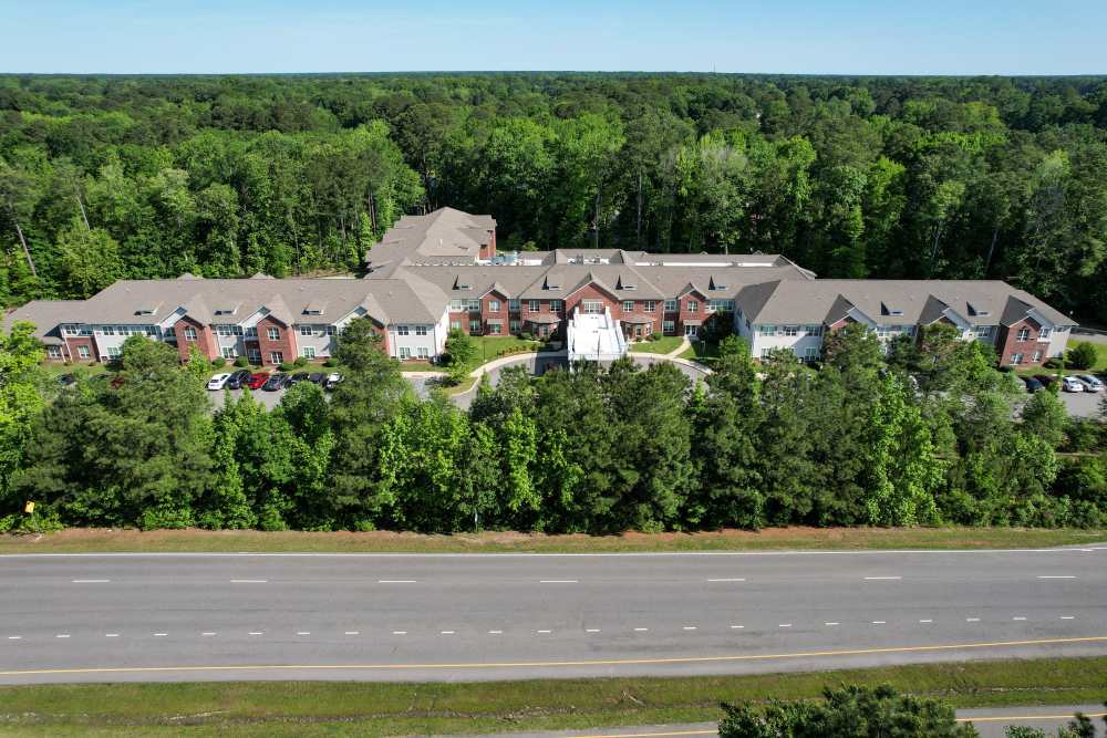 View of apartments with lots of greenery around at Harmony on the Peninsula in Yorktown, Virginia