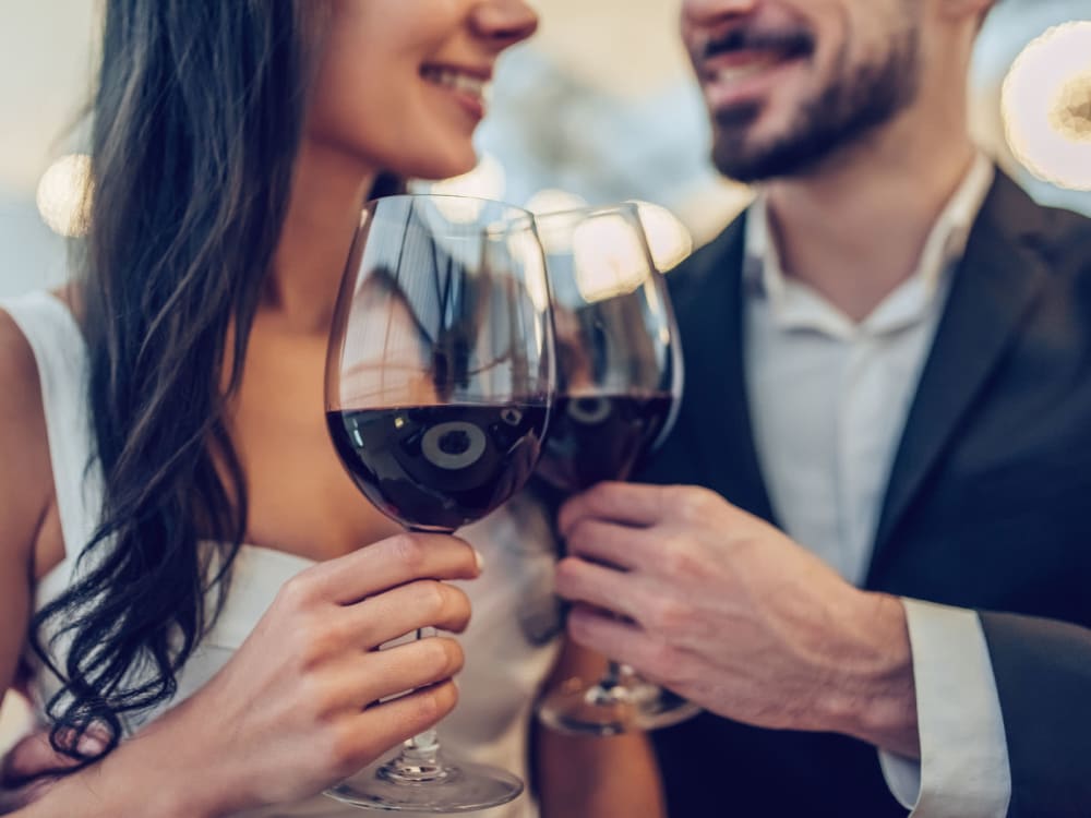 Couple dressed up for a night out enjoying some fine wine near Sentio in Glendale, Arizona