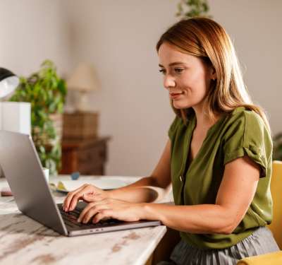 Woman on a laptop at Wrenfield at Pleasant View in , WI