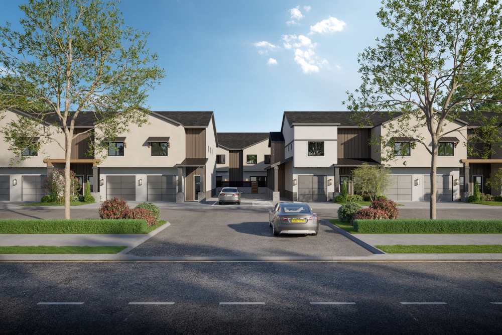 View townhomes with car parking of Canyon Townhomes from across the street in Phoenix, Arizona