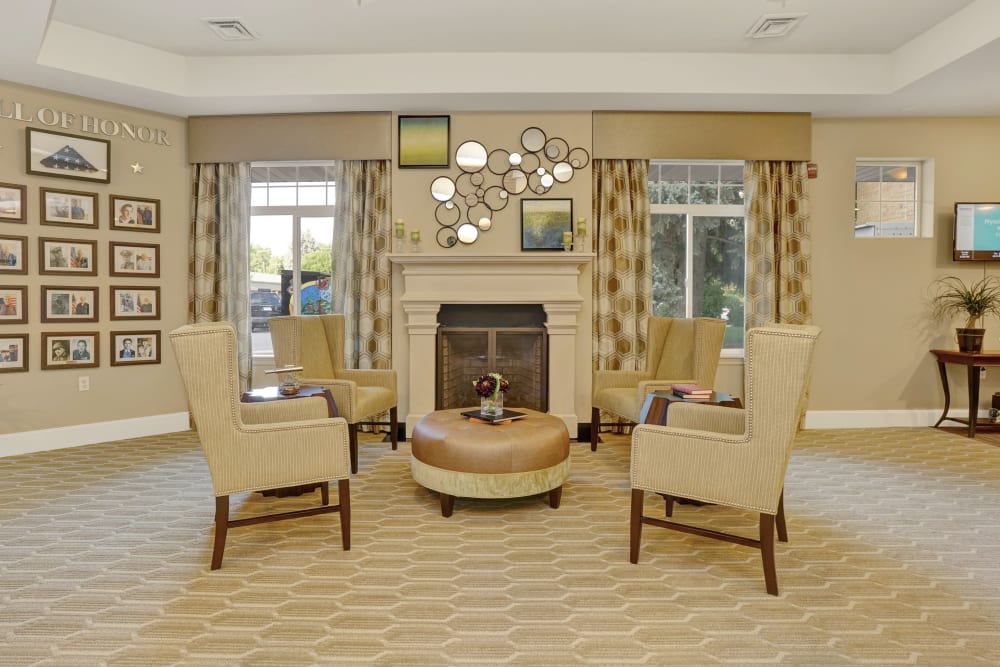 White sitting room with fireplace at Hillcrest of Loveland in Loveland, Colorado