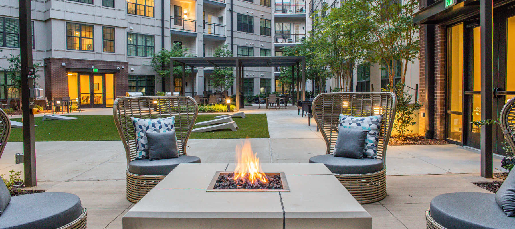 A community firepit with outdoor seating at Allegiant-Carter Management in Tampa, Florida