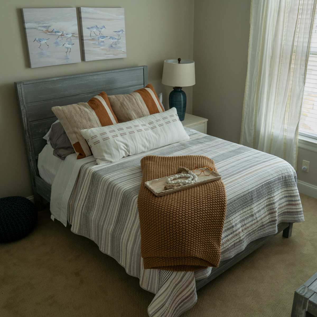 Cozy bedrooms with large window at Harmony at Glasgow in Newark, Delaware