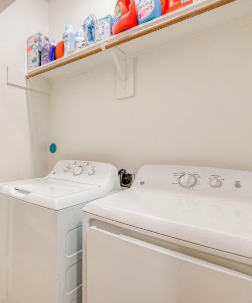 An in-home washer and dryer at Huntsville Village Apartments in Huntsville, Texas