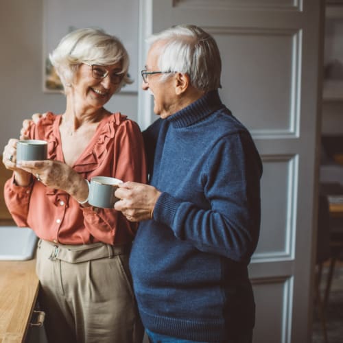 Couple drinking coffee together in the kitchen at Oxford Vista Wichita in Wichita, Kansas