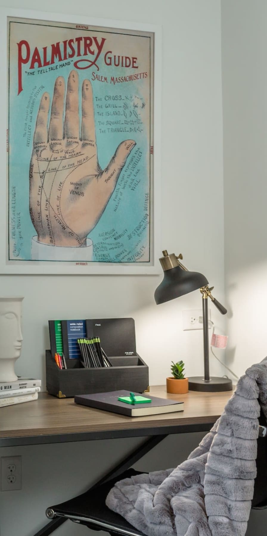 Desk and poster in a student apartment at The Altitude in Harrisonburg, Virginia