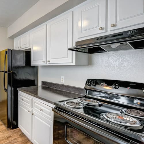 Black appliances in an apartment kitchen at Costa Del Lago in Lake Worth, Florida